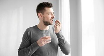 a man is taking medication to treat prostatitis